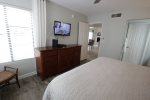 Flat screen wall mounted TV in the king bedroom